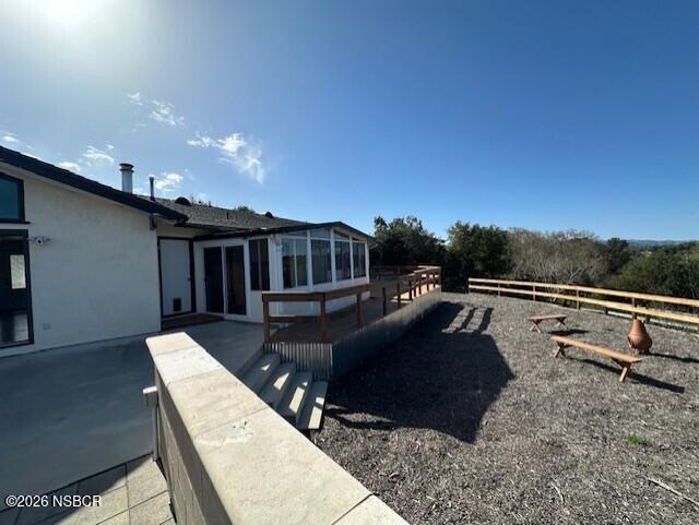 2585 Quail Valley Road Solvang, CA 93463 - Photo 21 of 25 a view of a terrace with chairs and a table