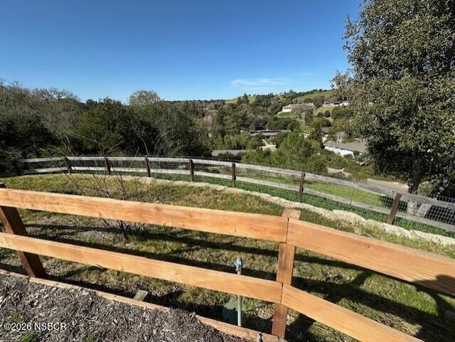 2585 Quail Valley Road Solvang, CA 93463 - Photo 22 of 25 a view of a yard with wooden fence