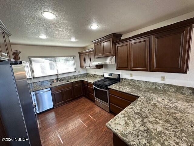 2585 Quail Valley Road Solvang, CA 93463 - Photo 6 of 25 a large kitchen with granite countertop stainless steel appliances and wooden cabinets