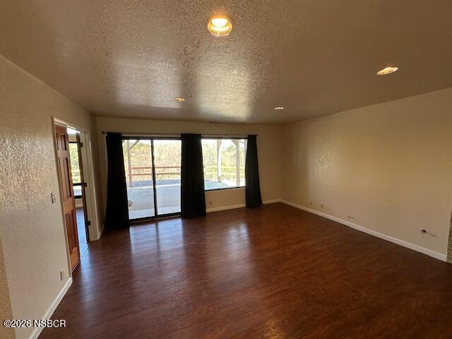 2585 Quail Valley Road Solvang, CA 93463 - Photo 8 of 25 an empty room with wooden floor and windows