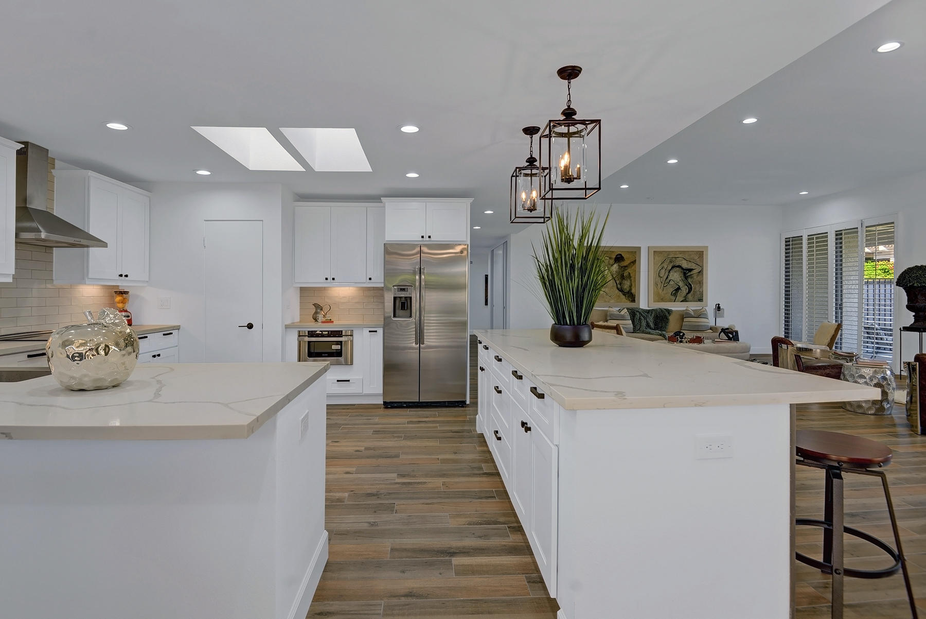 34 Duke Drive Rancho Mirage, CA 92270 - Photo 11 of 32 a kitchen with kitchen island granite countertop a sink counter top space appliances and cabinets