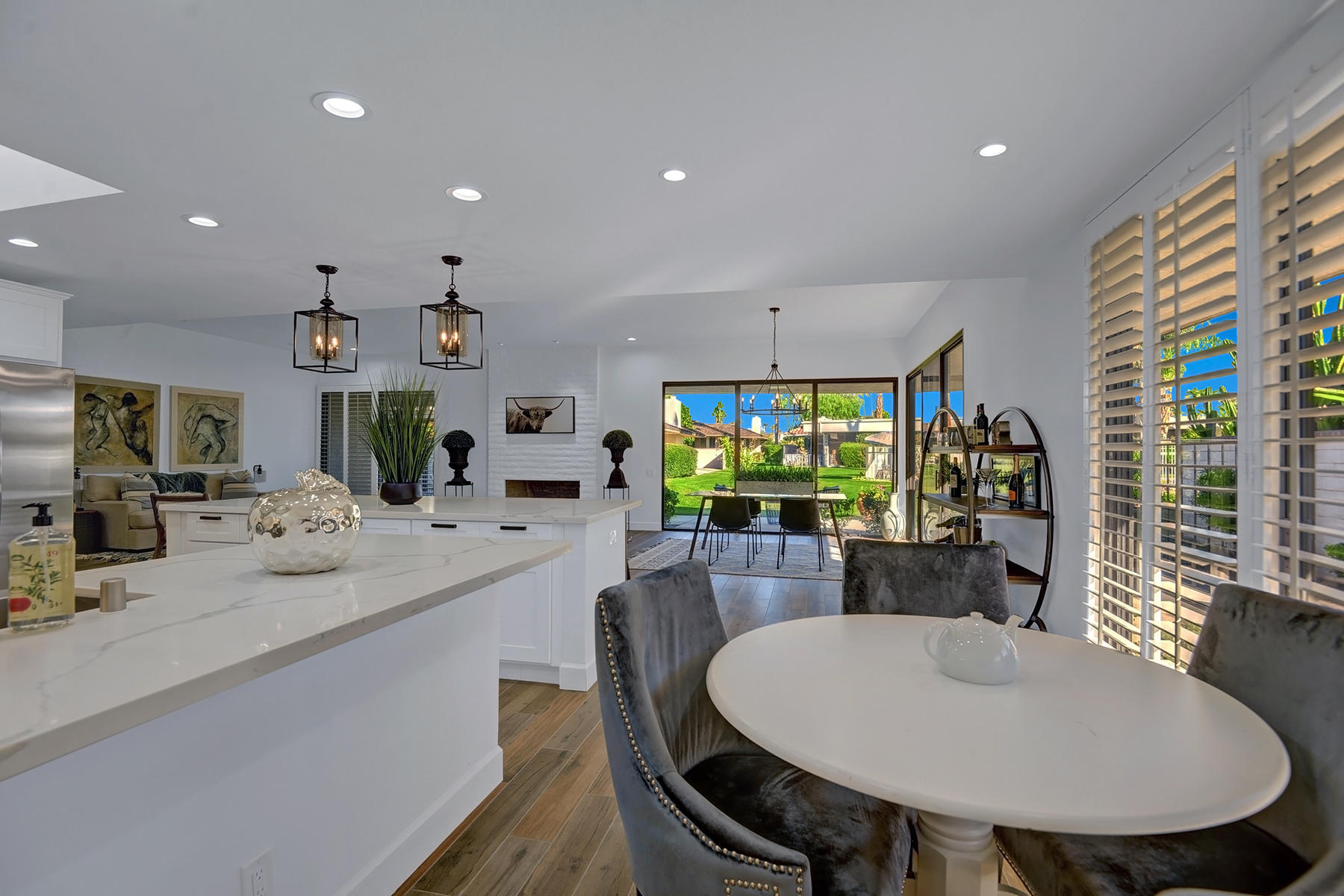 34 Duke Drive Rancho Mirage, CA 92270 - Photo 13 of 32 a dining room with stainless steel appliances furniture a window and kitchen view