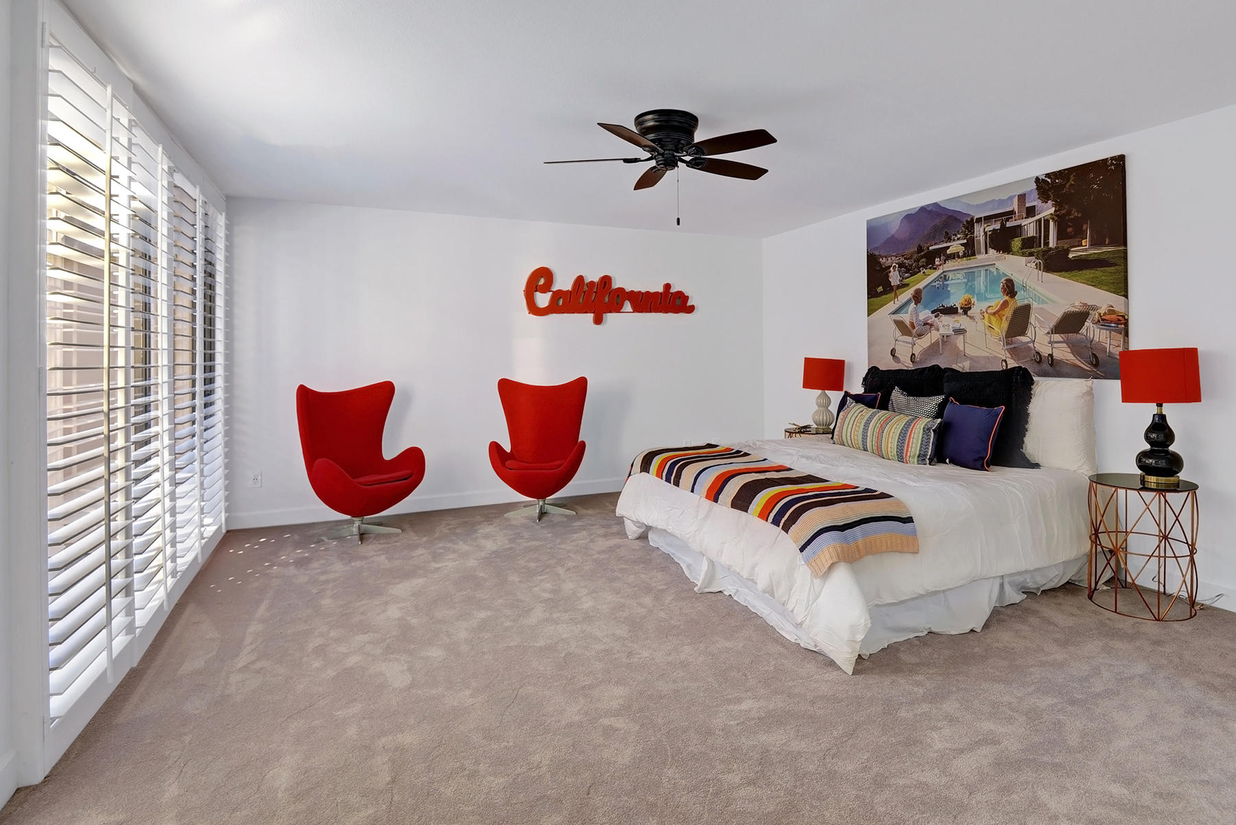 34 Duke Drive Rancho Mirage, CA 92270 - Photo 18 of 32 a bedroom with a bed and a painting on the wall