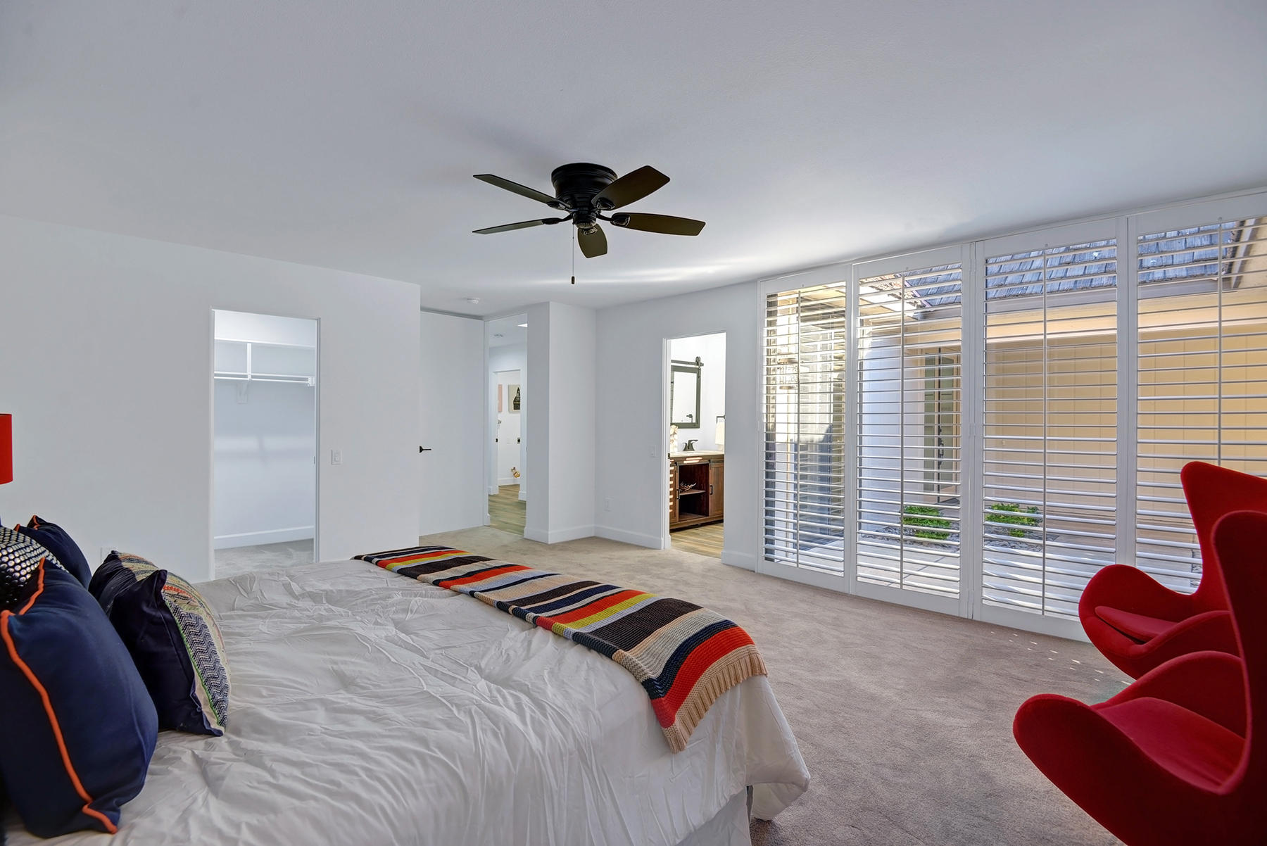 34 Duke Drive Rancho Mirage, CA 92270 - Photo 19 of 32 a bedroom with a bed and a large window
