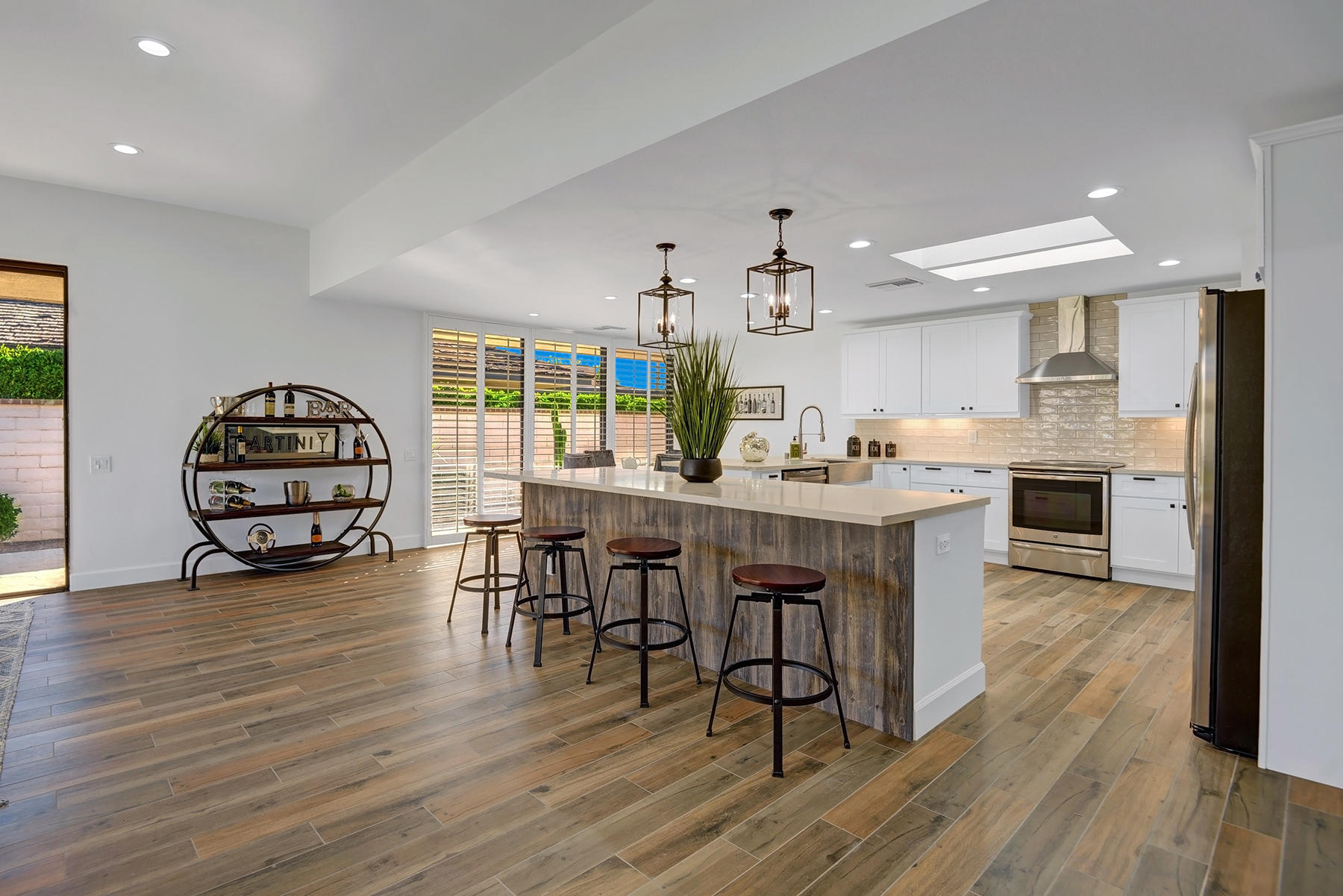 34 Duke Drive Rancho Mirage, CA 92270 - Photo 9 of 32 a kitchen with a table chairs and a stove