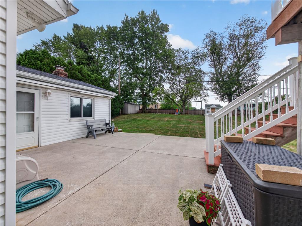 3046 Ridon Court Bethlehem, PA 18020 - Photo 11 of 41 A spacious backyard patio provides ample room for outdoor enjoyment and direct access to a verdant lawn.
