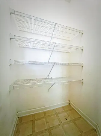 a view of a room with racks on the wall