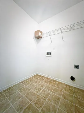 a bathroom with a window and a shower