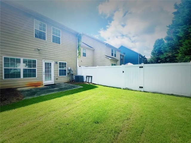 a view of a white house in front of a house