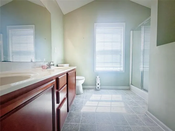 a bathroom with a sink a vanity and a bathtub