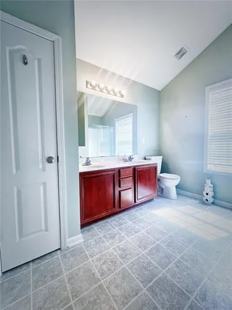 a bathroom with a mirror and a sink