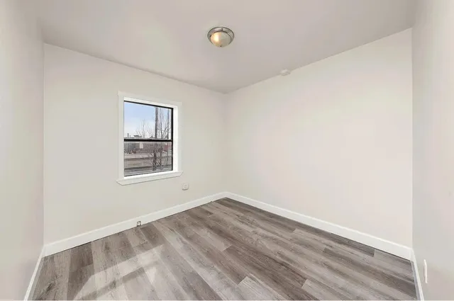 a view of a room that has a window in it