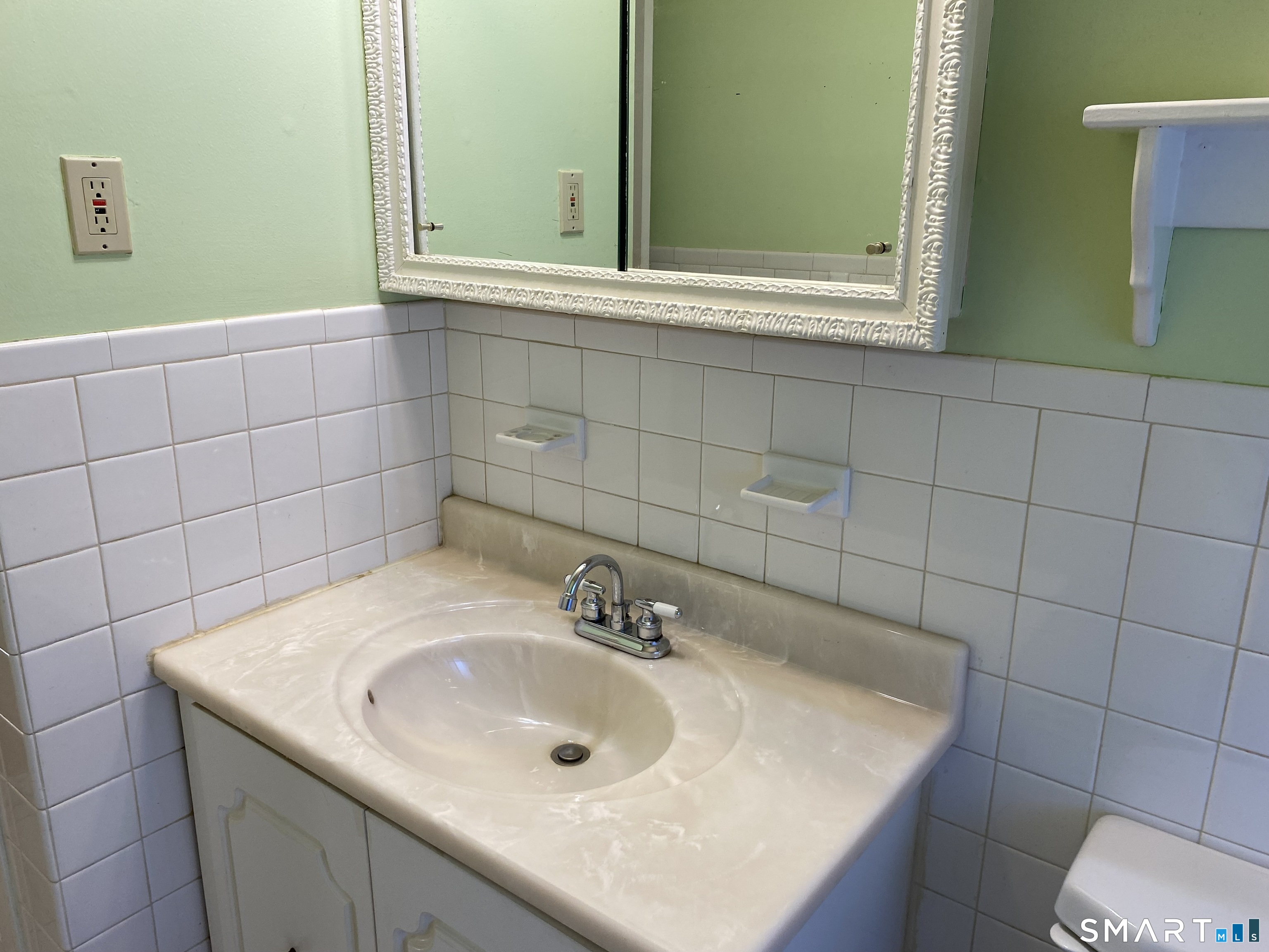57 Carriage Path South Milford, CT 06460 - Photo 11 of 11 a bathroom with a sink and a mirror