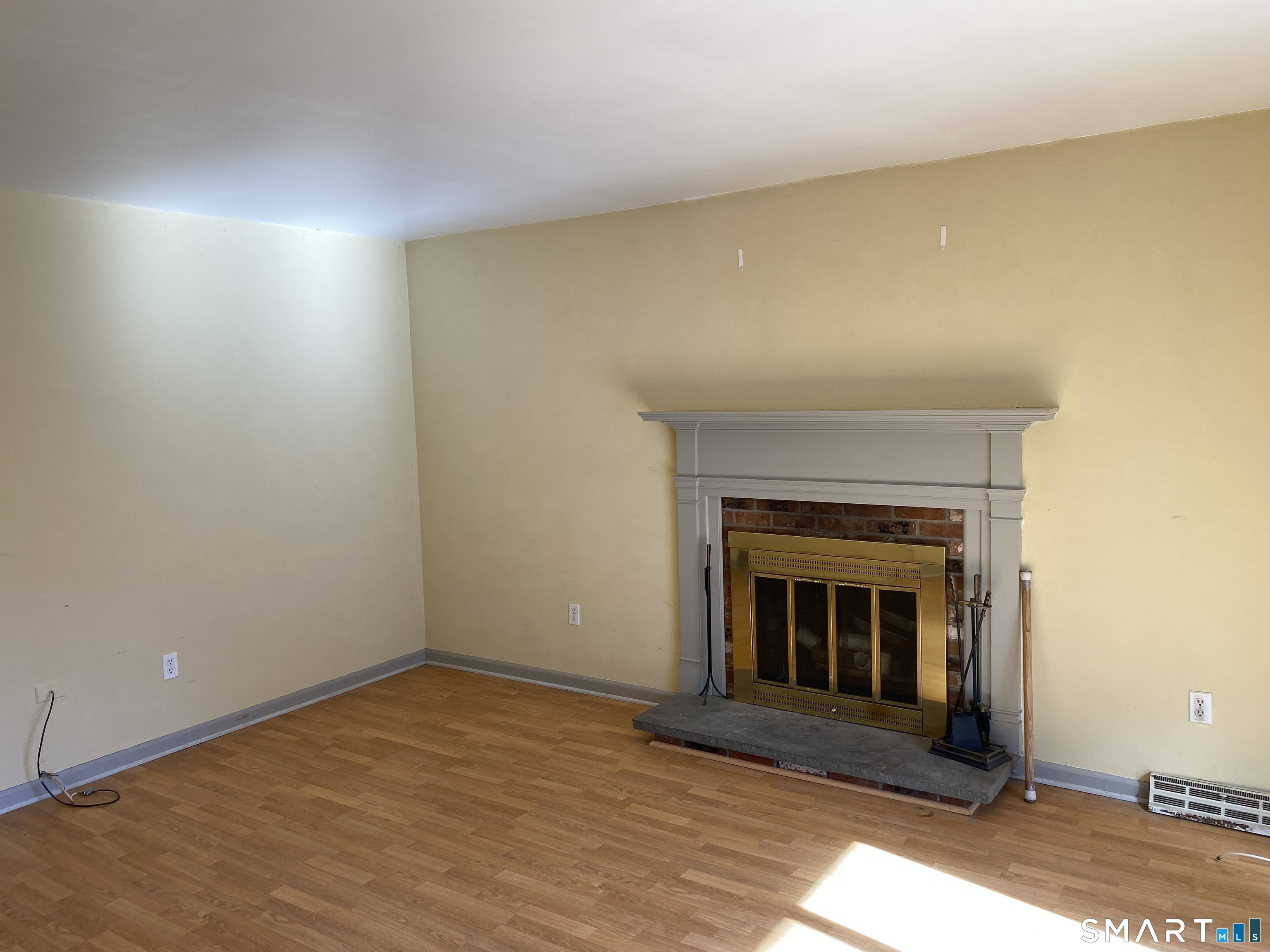 57 Carriage Path South Milford, CT 06460 - Photo 3 of 11 a view of an empty room and fire place