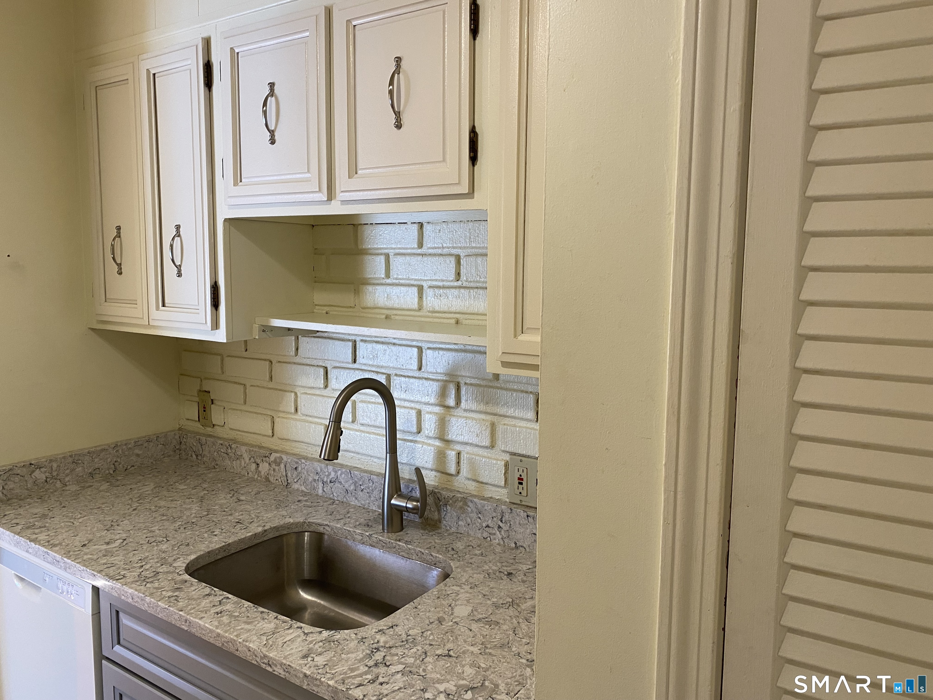 57 Carriage Path South Milford, CT 06460 - Photo 8 of 11 a close view of sink and tap