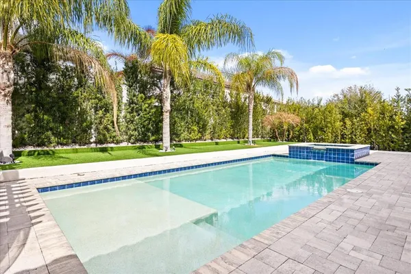 a bedroom with furniture and a flat screen tv