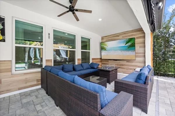 a kitchen with stainless steel appliances granite countertop a refrigerator a stove and a sink