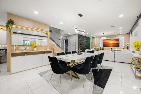 a kitchen with stainless steel appliances granite countertop a stove and white cabinets