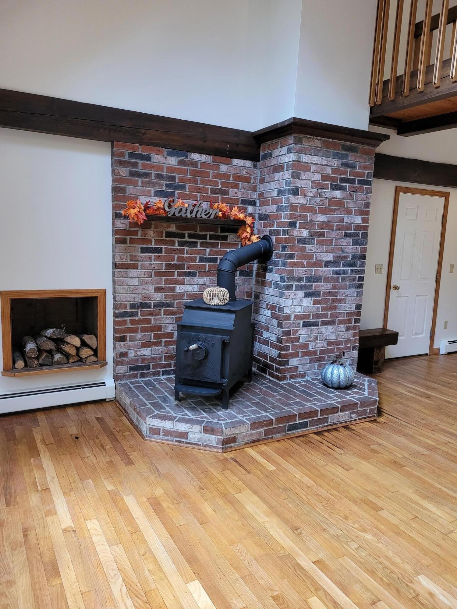90 Old Norridgewock Road Fairfield, ME 04937 - Photo 10 of 45 Brick hearth stove