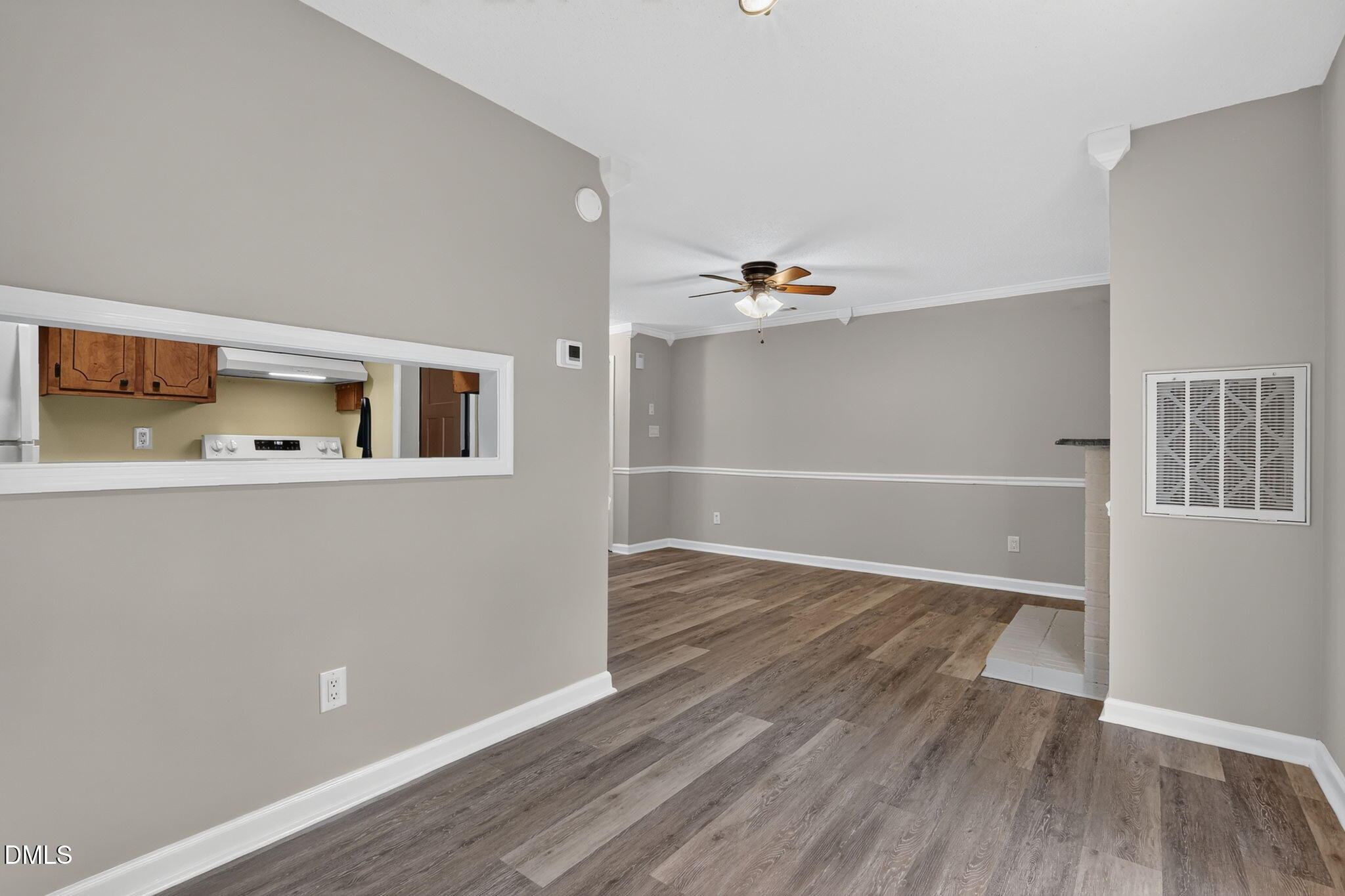 3425 Mill Run Raleigh, NC 27612 - Photo 16 of 40 a view of an empty room with wooden floor