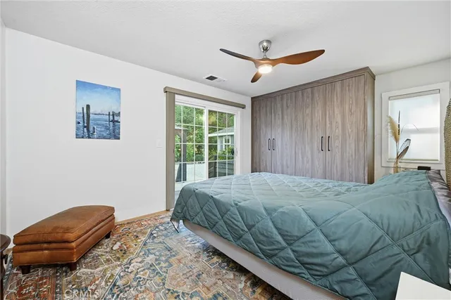 a kitchen with a refrigerator and cabinets