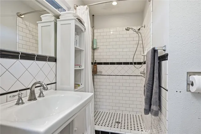 a bathroom with a sink and a shower