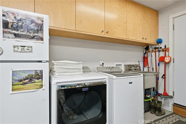 a view of a workspace with furniture and a workspace