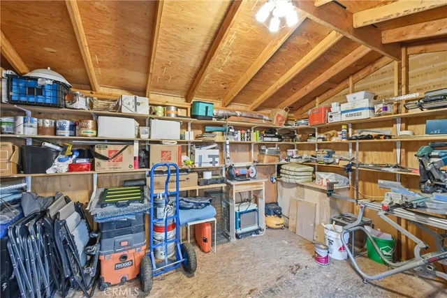 a view of a patio with a table chairs and a backyard