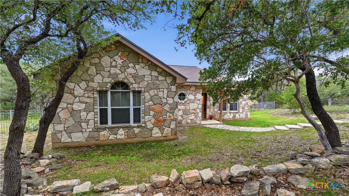 2216 Hornsby Spring Branch, TX 78070 - Photo 29 of 33 a view of a house with backyard and a tree