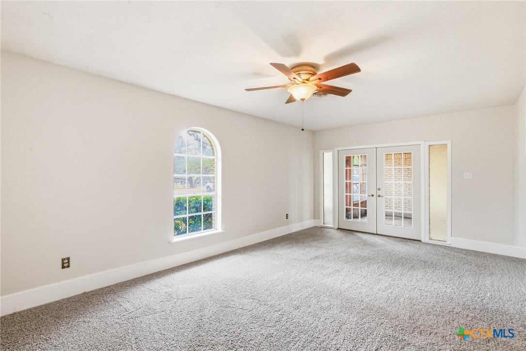 703 Tranquillo Drive Victoria, TX 77905 - Photo 23 of 34 Primary Bedroom with French Doors to Flex Room
