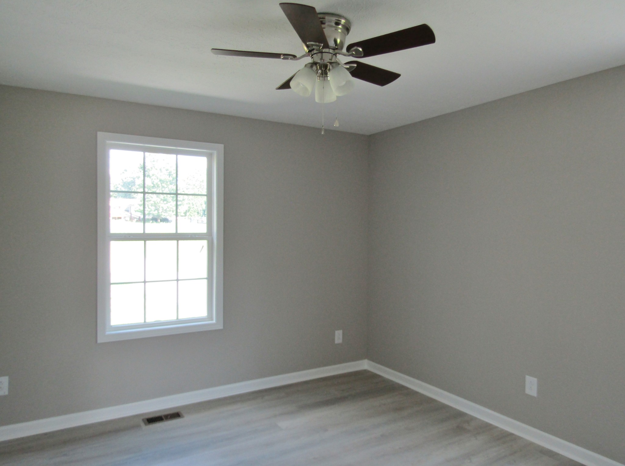 308 Ostella Road Cornersville, TN 37047 - Photo 16 of 19 an empty room with a window and a fan