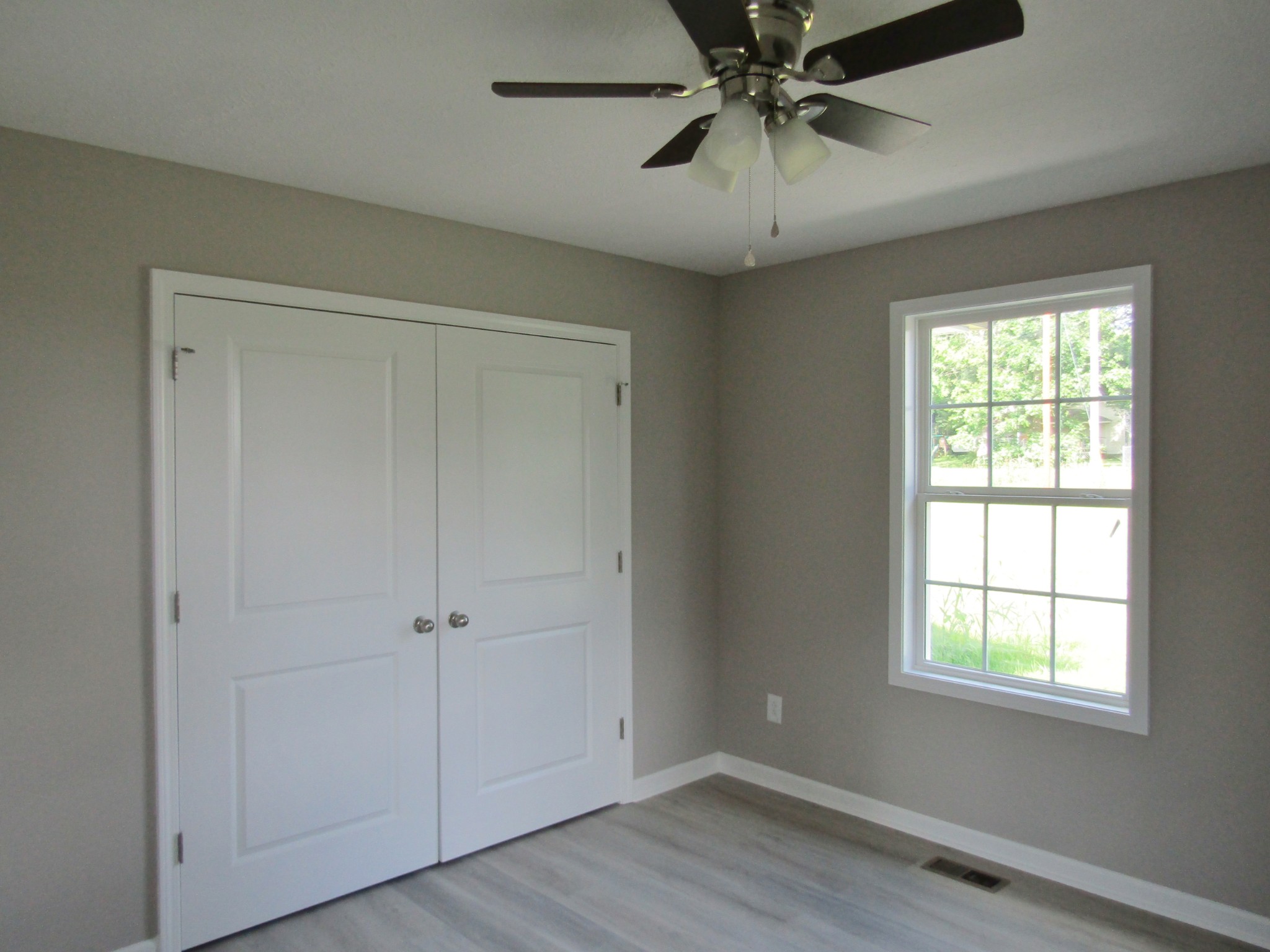 308 Ostella Road Cornersville, TN 37047 - Photo 17 of 19 a view of an empty room with a window