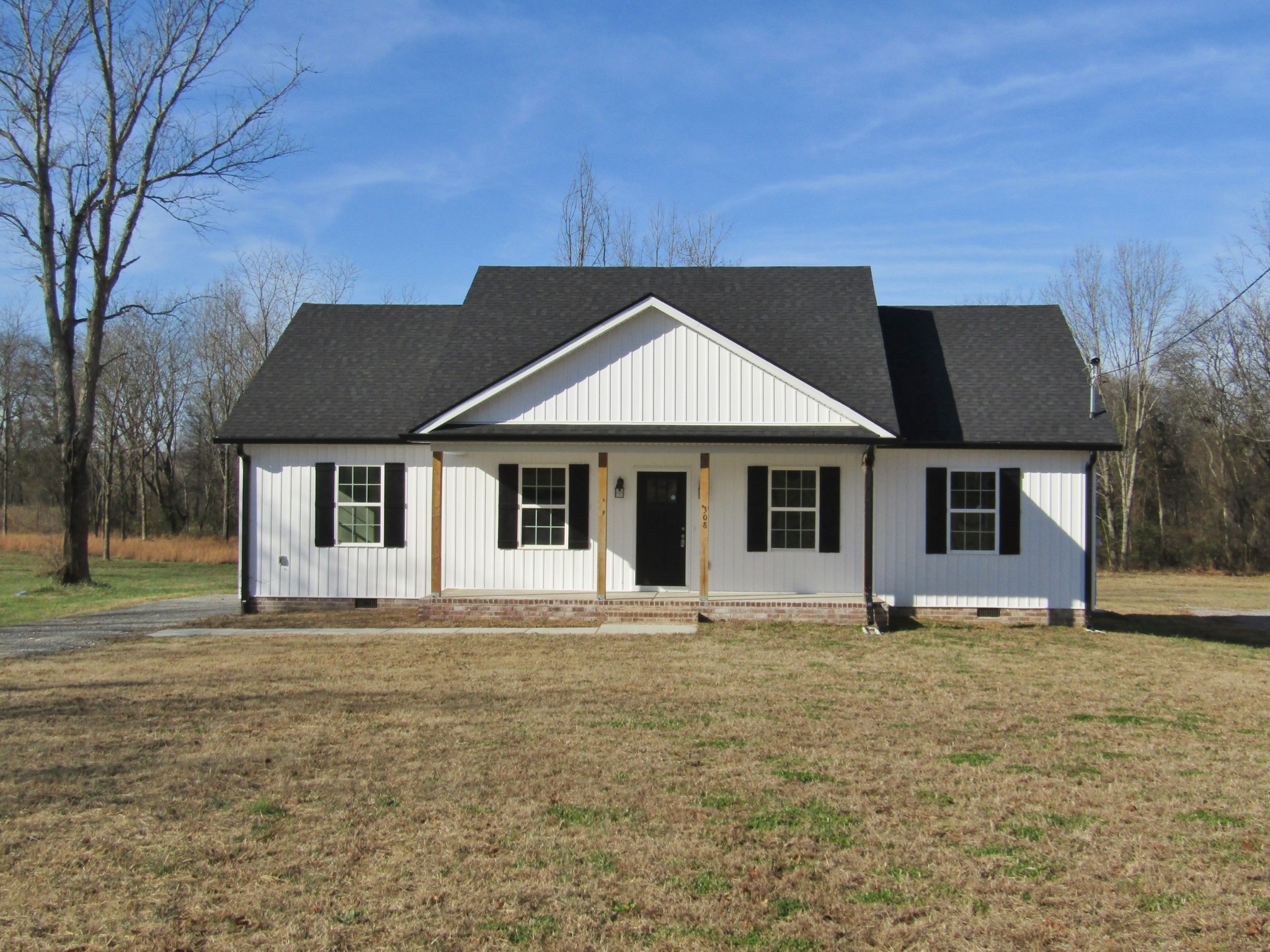 308 Ostella Road Cornersville, TN 37047 - Photo 2 of 19 a house that has a big yard
