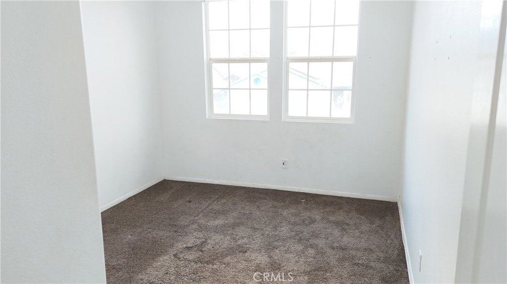 176 Nightfall Road San Jacinto, CA 92582 - Photo 10 of 11 an empty room with a window