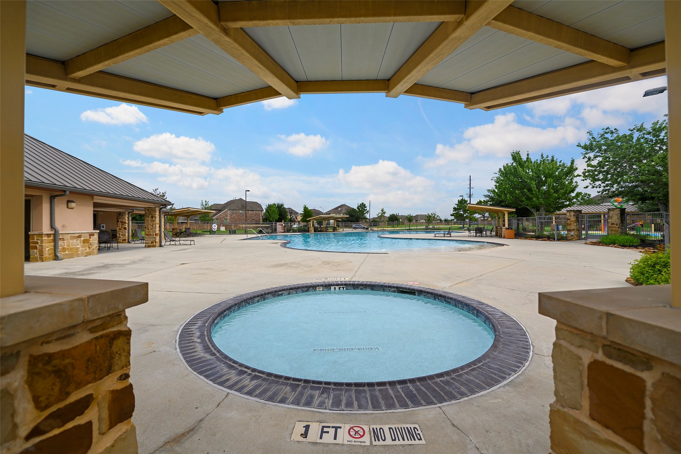 20330 Rosegold Way Spring, TX 77379 - Photo 44 of 48 Community wading pool for younger children adjacent to the main swimming pool.