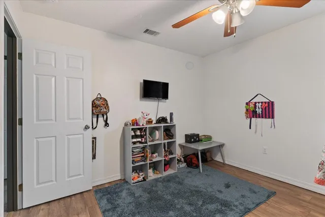 a view of a workspace with furniture and natural light