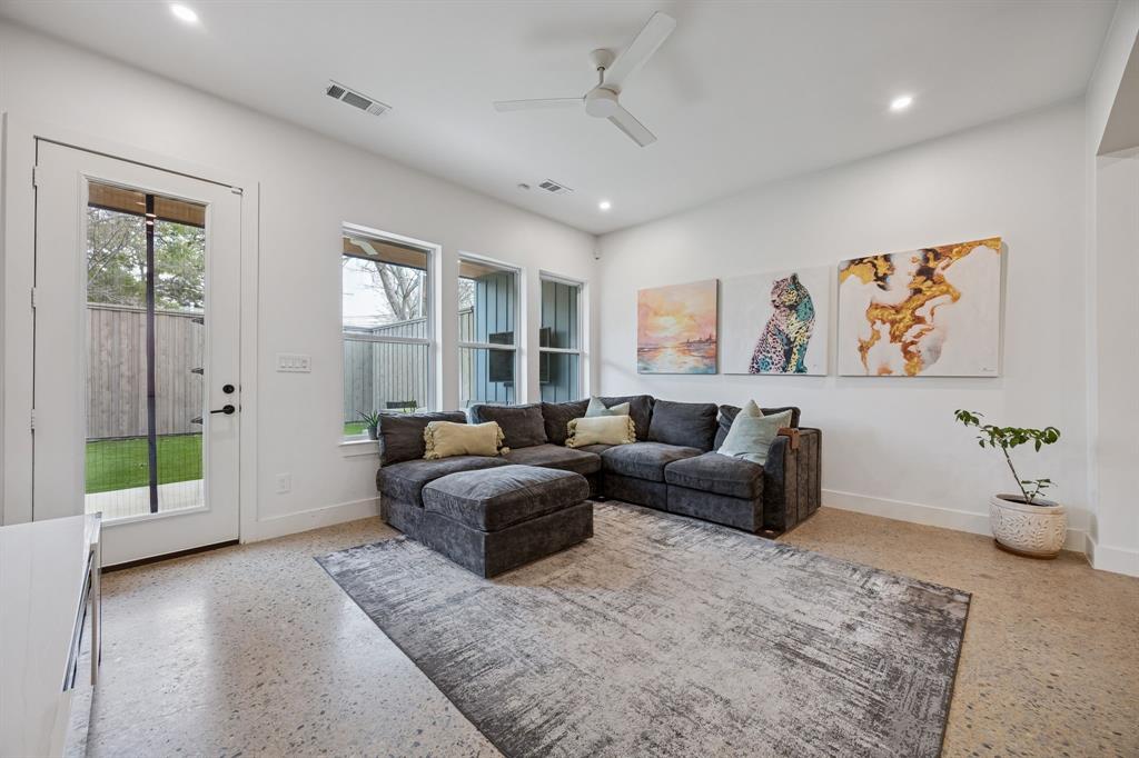 5104 Vandelia Street Dallas, TX 75235 - Photo 13 of 40 a living room with furniture and a flat screen tv