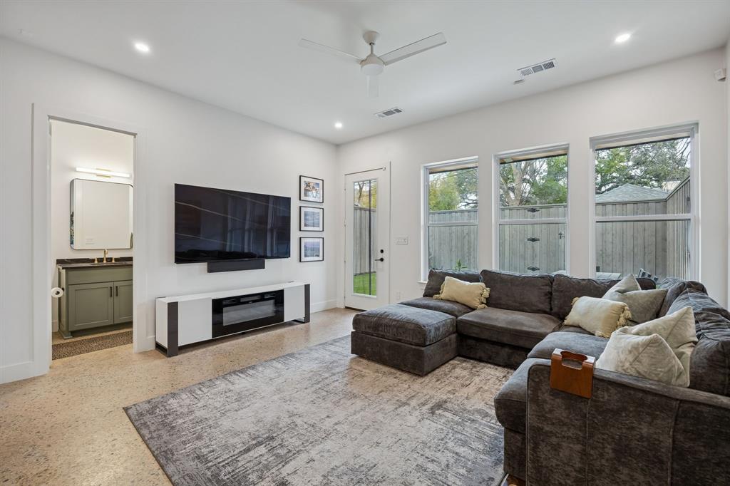 5104 Vandelia Street Dallas, TX 75235 - Photo 14 of 40 a living room with furniture and a flat screen tv