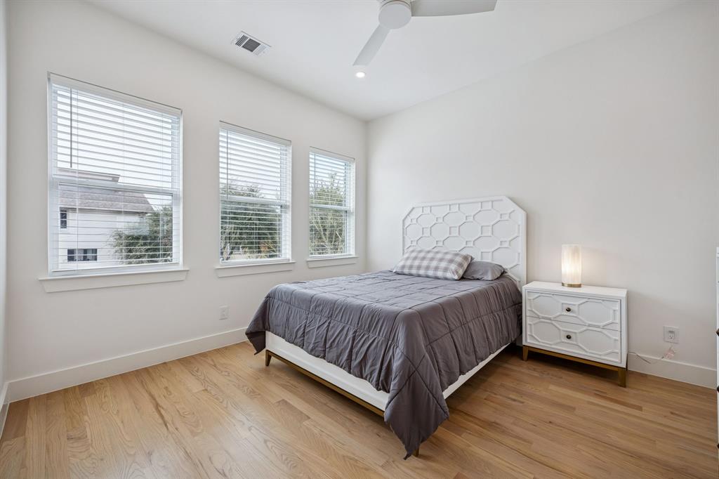 5104 Vandelia Street Dallas, TX 75235 - Photo 19 of 40 a bedroom with a bed and window