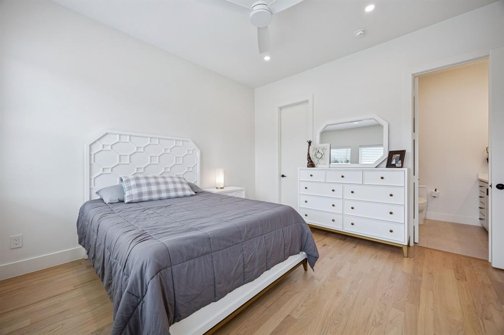 5104 Vandelia Street Dallas, TX 75235 - Photo 20 of 40 a bedroom with a bed and a dresser