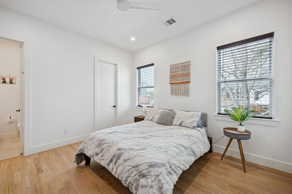 5104 Vandelia Street Dallas, TX 75235 - Photo 24 of 40 a bedroom with a bed and a window