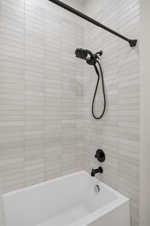 5104 Vandelia Street Dallas, TX 75235 - Photo 26 of 40 a bathroom with a bath tub with a shower