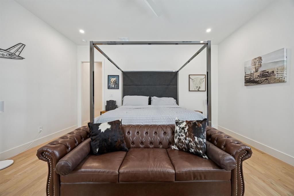 5104 Vandelia Street Dallas, TX 75235 - Photo 29 of 40 a bed room with a bed and couch