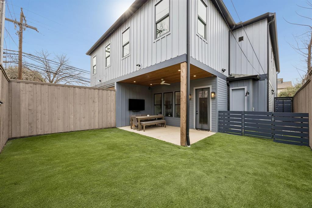 5104 Vandelia Street Dallas, TX 75235 - Photo 37 of 40 a view of a house with backyard and utility