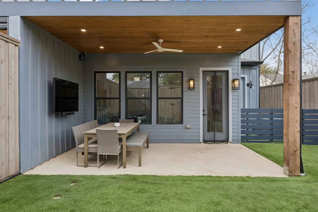 5104 Vandelia Street Dallas, TX 75235 - Photo 39 of 40 a view of a patio with table and chairs