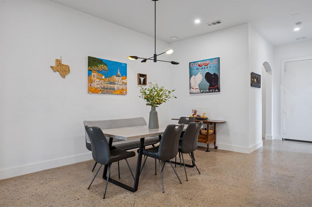 5104 Vandelia Street Dallas, TX 75235 - Photo 9 of 40 a view of a dining room with furniture and chandelier