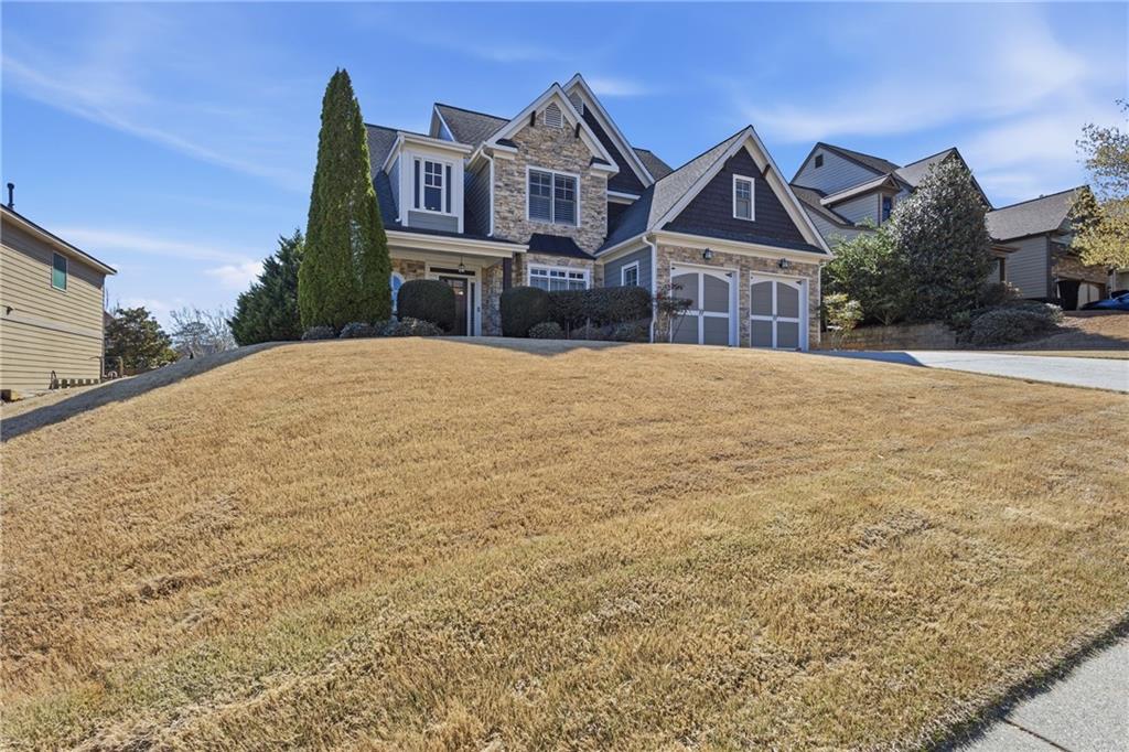 a front view of a house with a yard