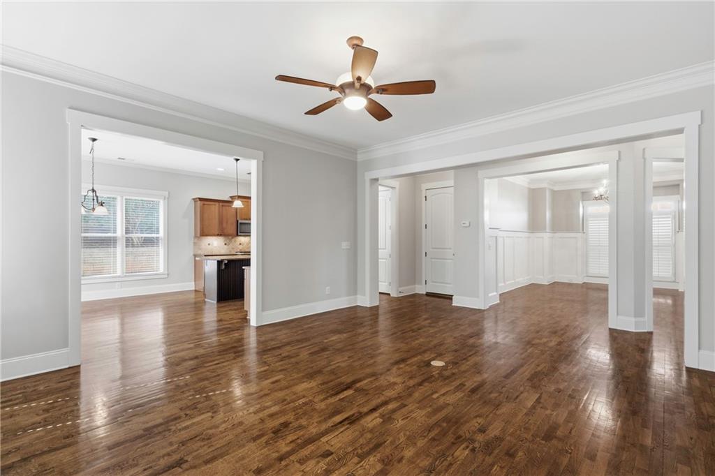 4340 Silent Path Cumming, GA 30028 - Photo 12 of 47 a view of empty room with wooden floor and ceiling fan