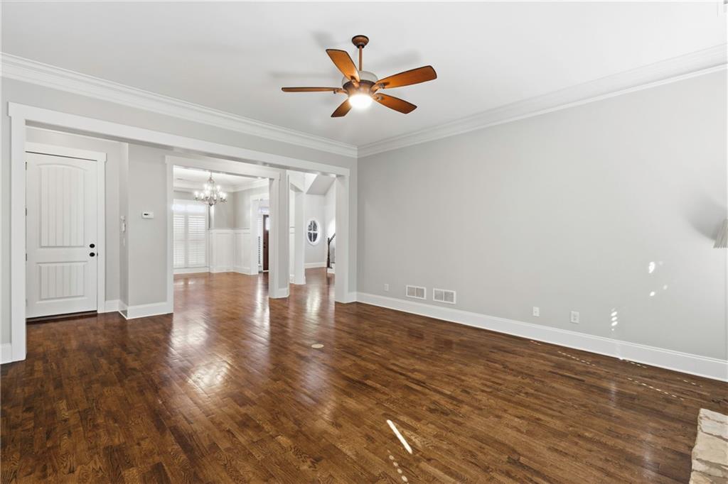 4340 Silent Path Cumming, GA 30028 - Photo 13 of 47 wooden floor in an empty room with a ceiling fan