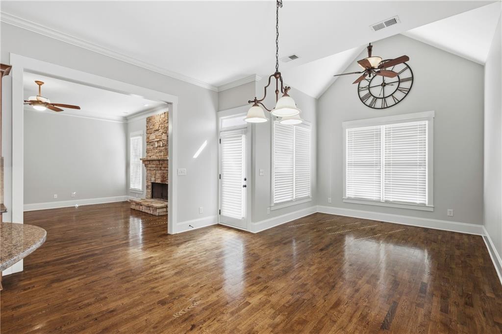 4340 Silent Path Cumming, GA 30028 - Photo 19 of 47 a view of an empty room with wooden floor and windows